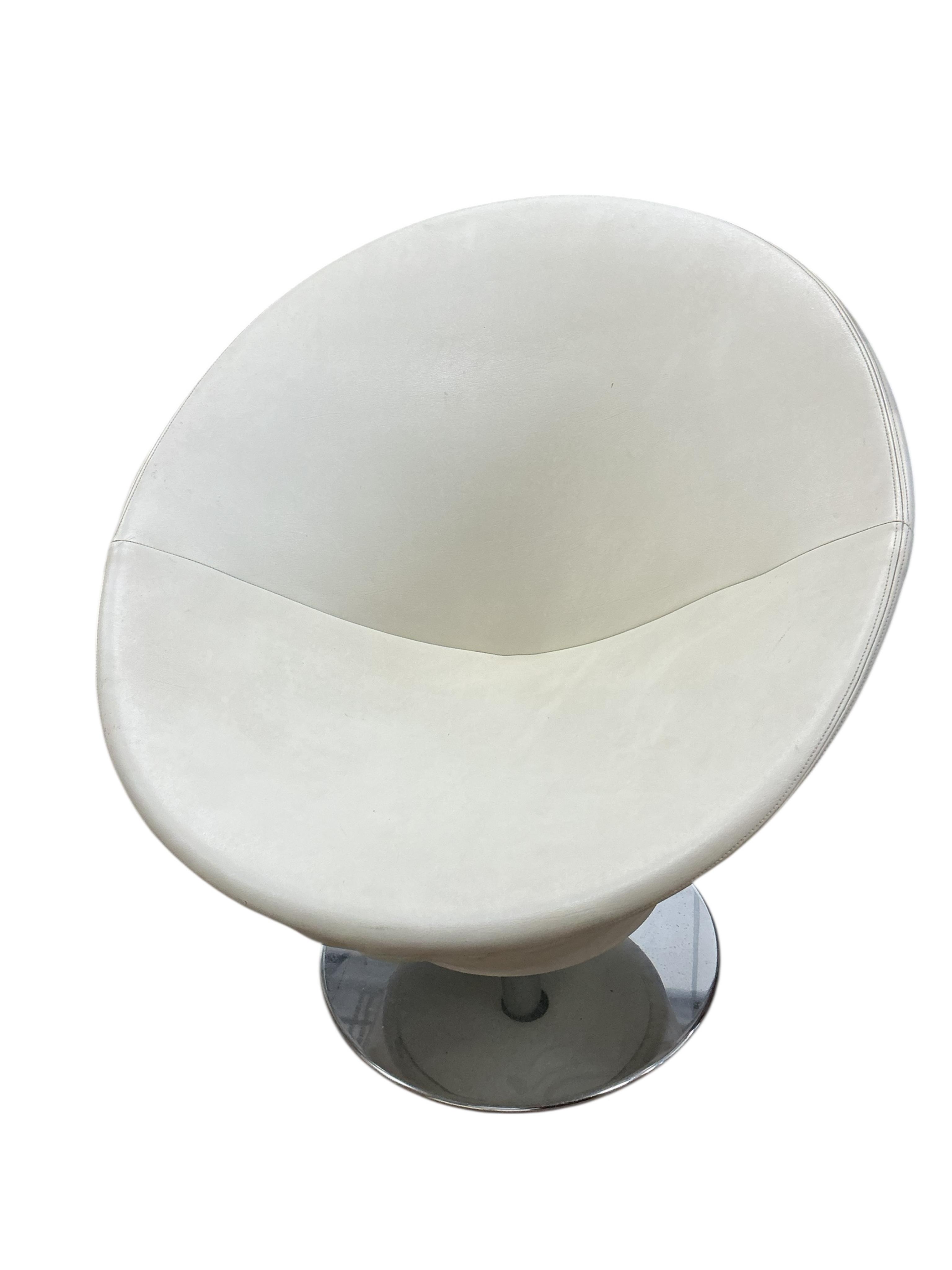 A pair of contemporary circular frame swivel lounge chairs on chrome bases, width 80cm, height 83cm